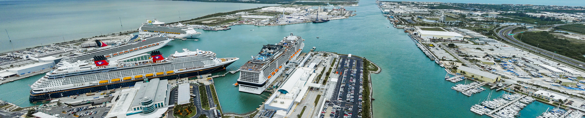 An image of several cruise ships docked in Port Canaveral.