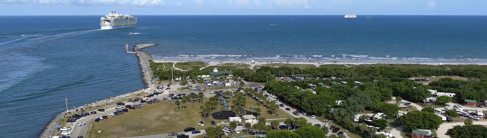 Arial image of Jetty Park Beach and Campground with cruise ships leaving