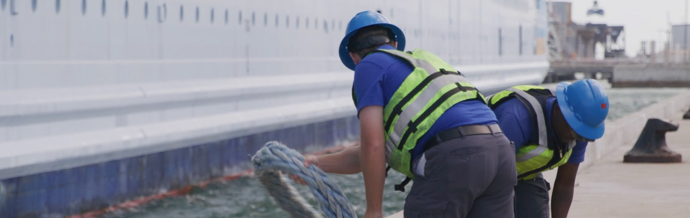 Linehandlers untying a cruise ship at Port Canaveral