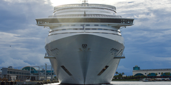 A front view of a cruise ship on a gloomy day.