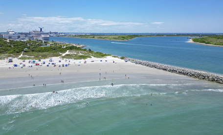 Aerial image of Port Canaveral's beautiful beach and pier