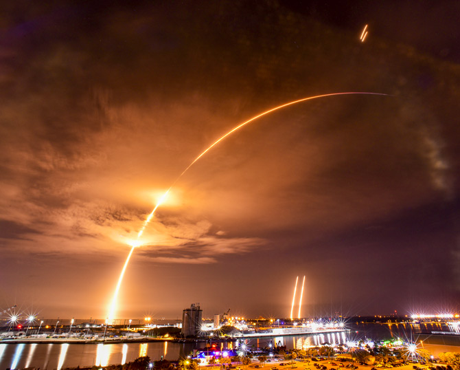 Double booster night launch and landing from Port Canaveral