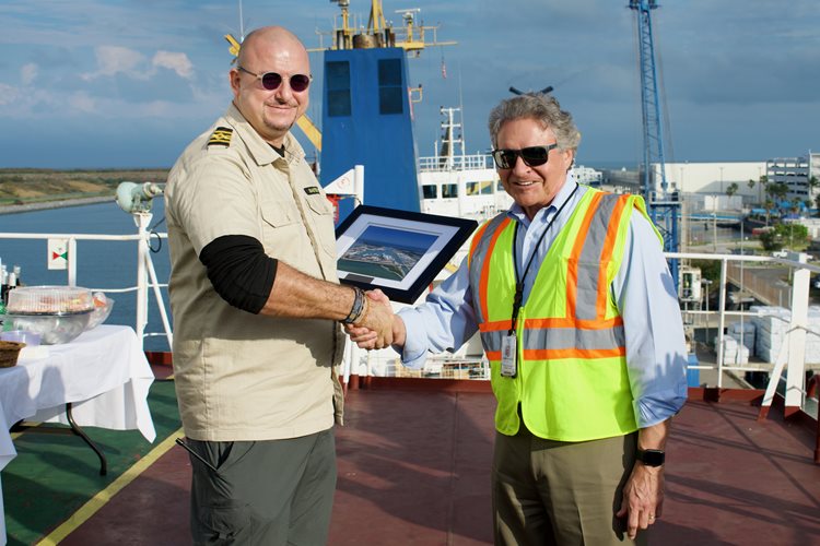 Port Canaveral CEO, Capt. John Murray presents welcoming plaque to  Bulk Valor Capt. Enver Akcora aboard the bulk carrier Bulk Valor