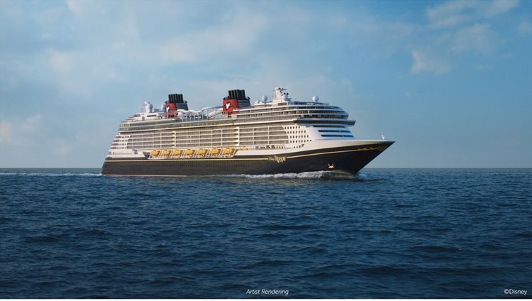 a cruise ship on the water with RMS Queen Mary in the background