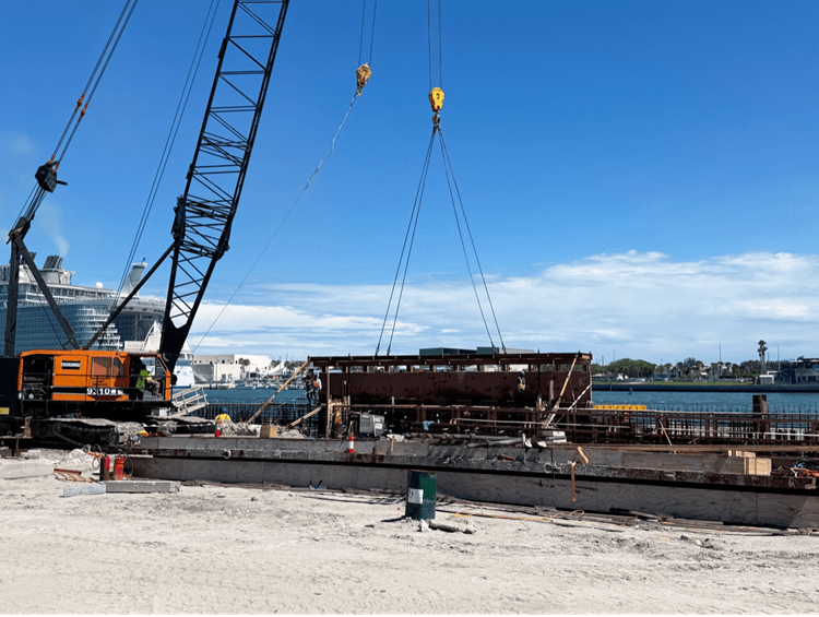 Crane places concrete form for the bulkhead cap at NCB4